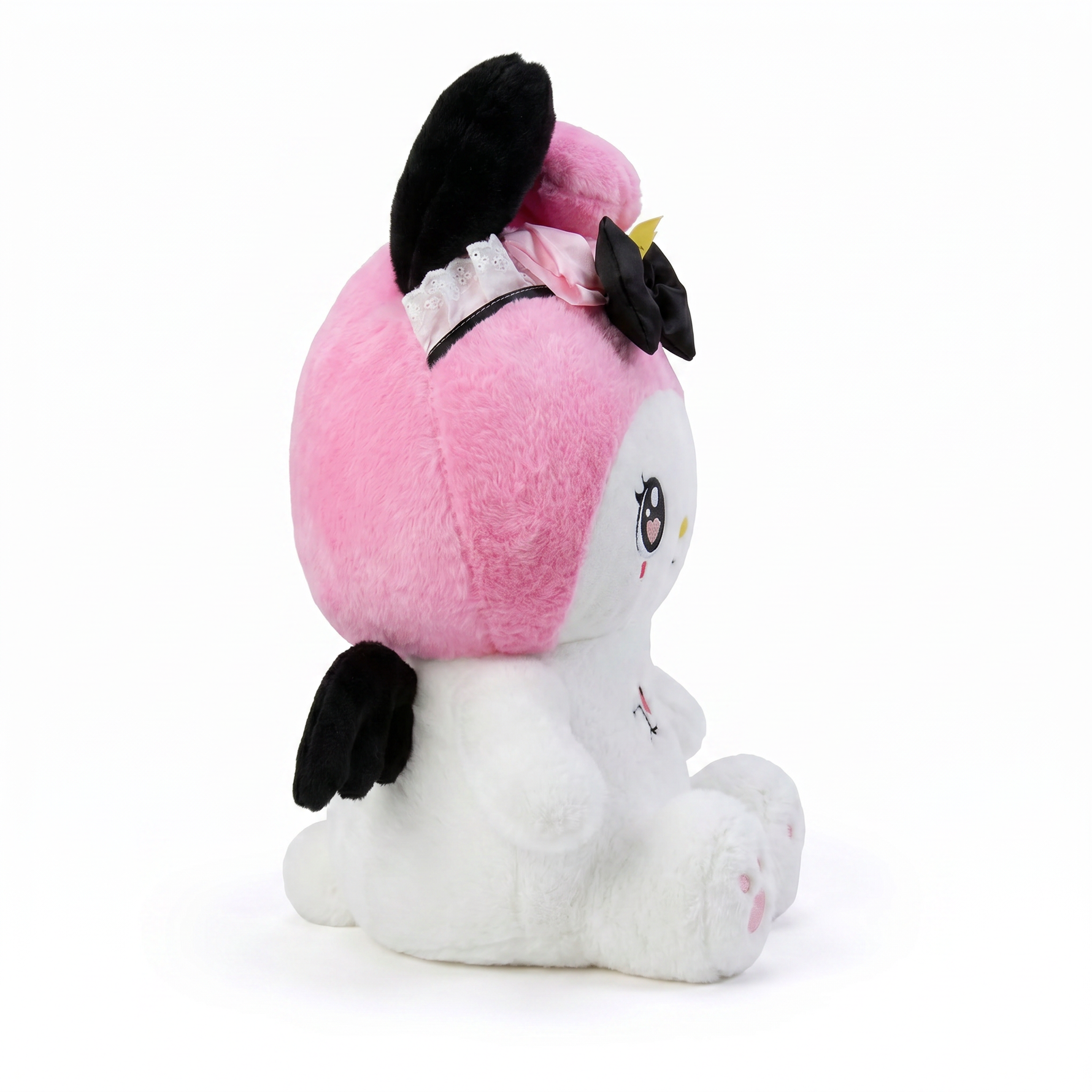 Pink plush character with big blue eyes, side view