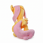Yellow pony plush with long pink mane, side view