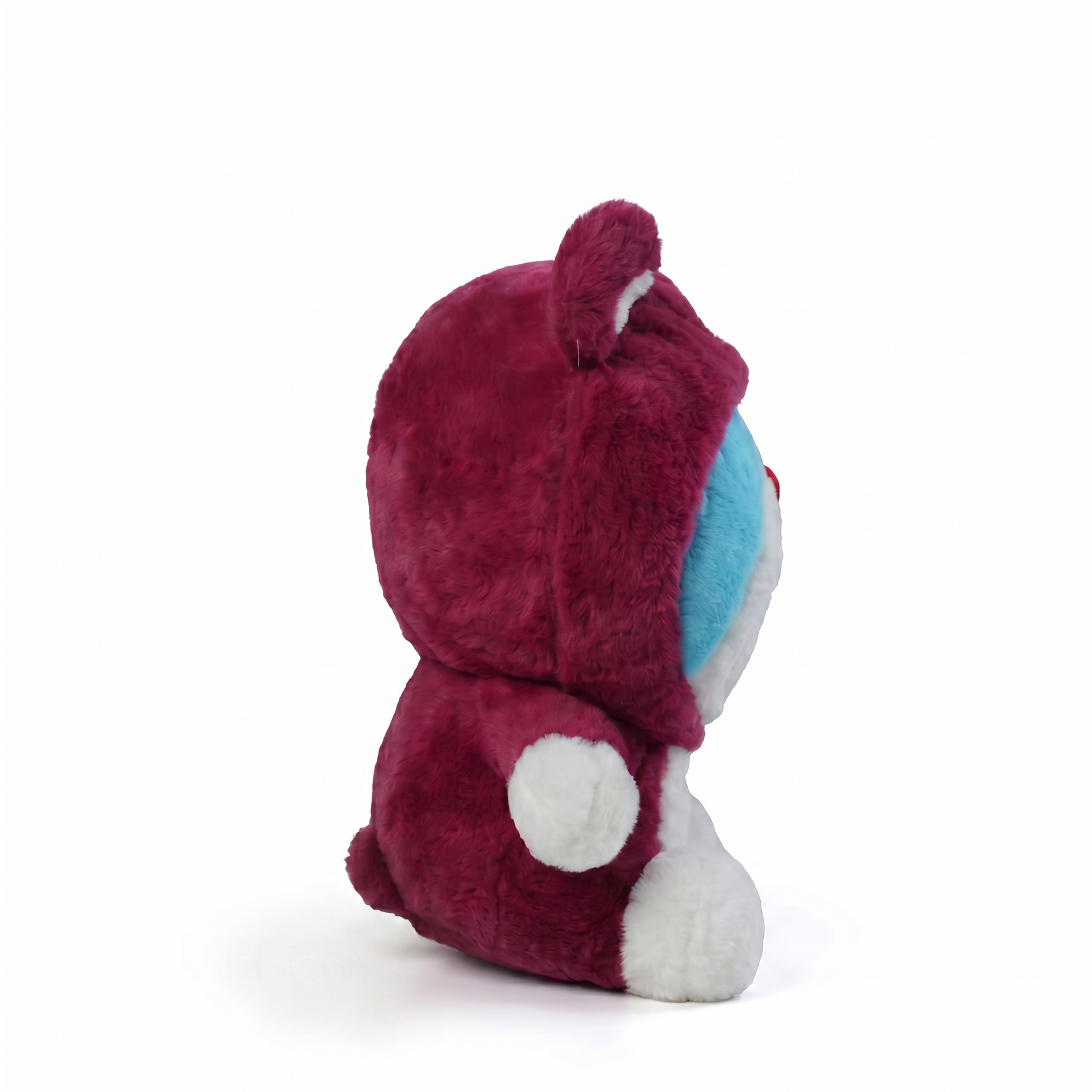 Pink bear plush wearing a blue cat costume, side view