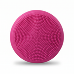 Pink inflatable balance cushion — textured massage-nub side