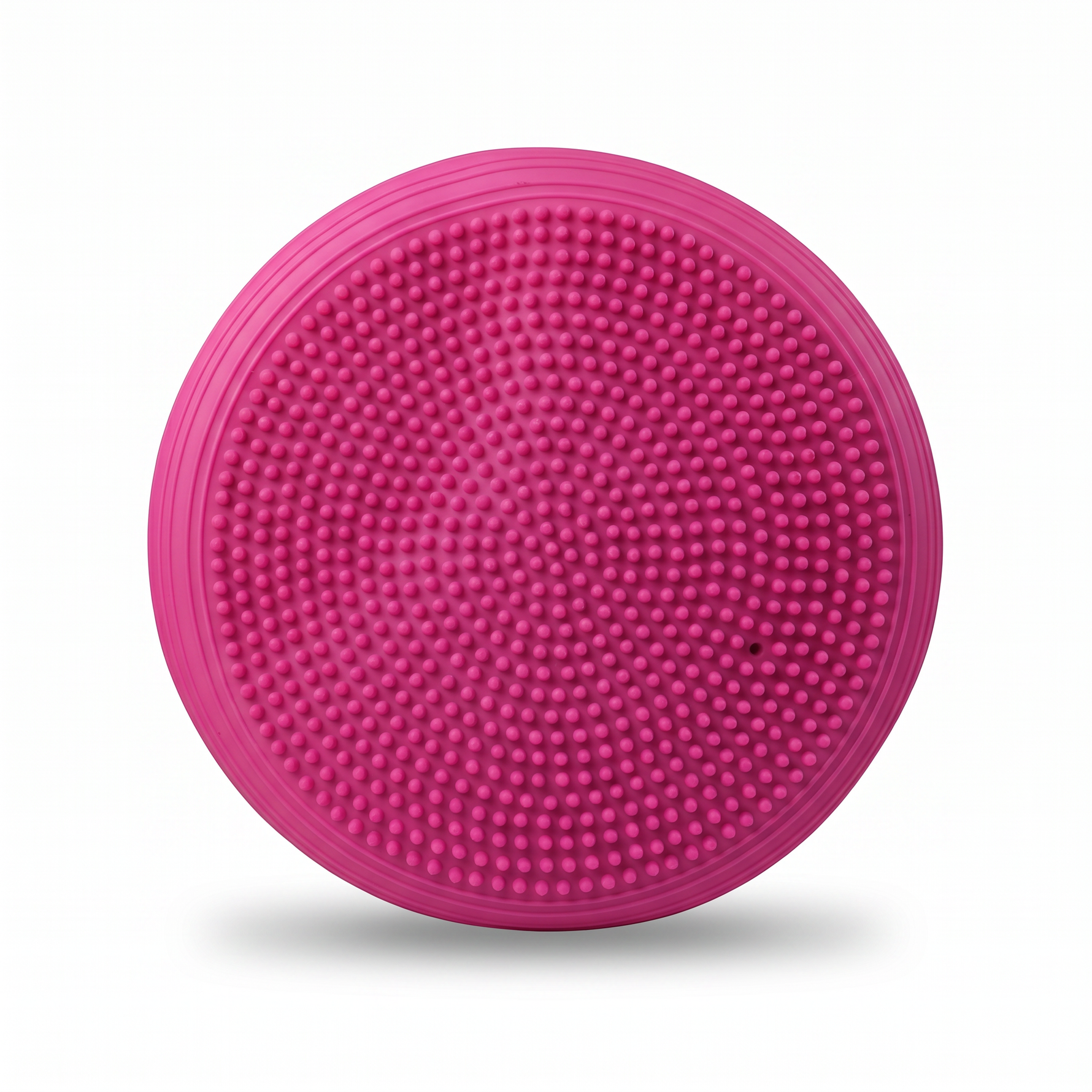 Pink inflatable balance cushion — textured massage-nub side