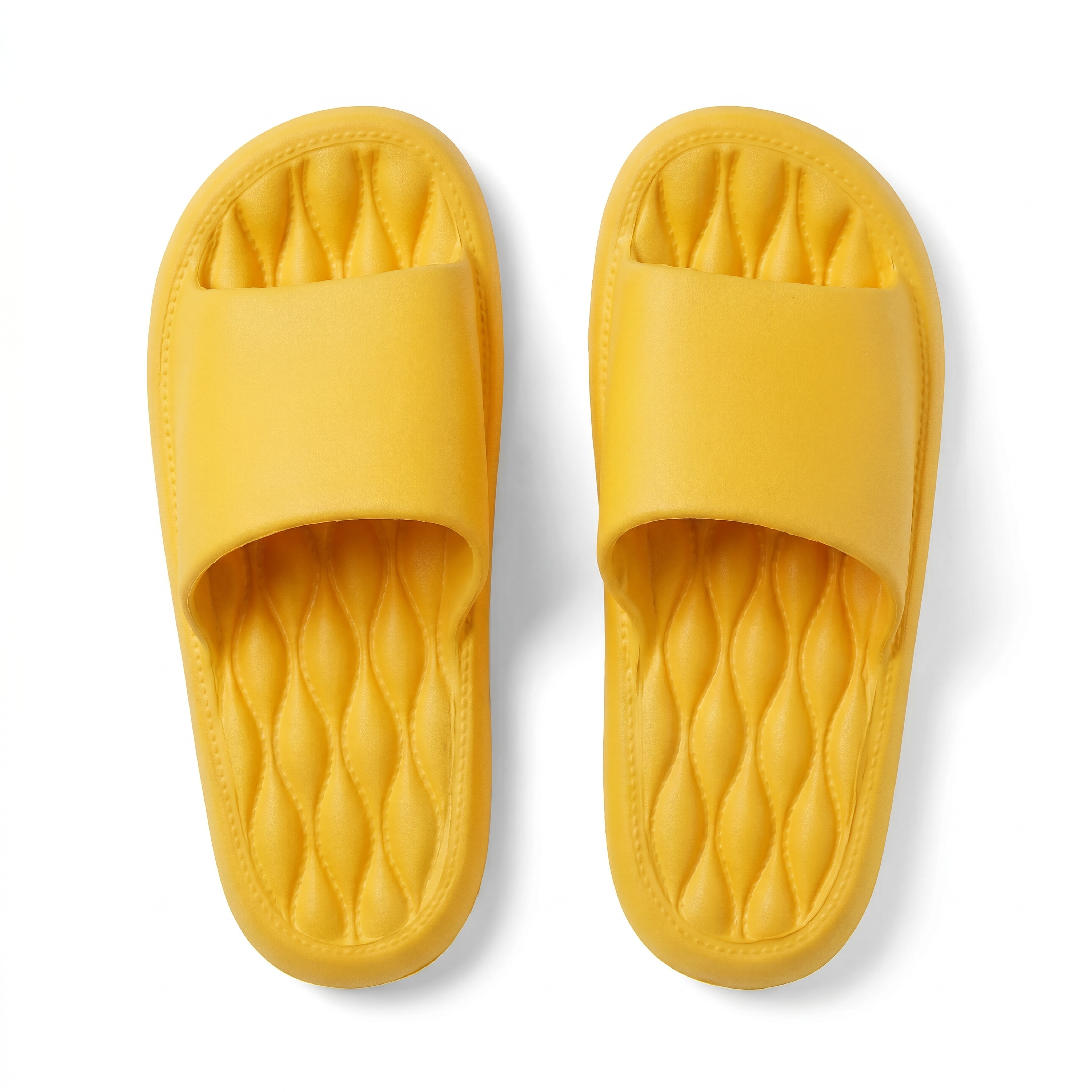 Yellow EVA slide sandals with quilted cushioned footbed — top view